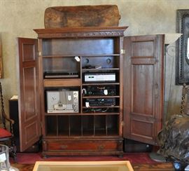 Custom interior of the armoire matches beautifully with the antique armoire