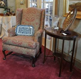Antique inlaid oval table with 2 Raul Guiterrez watercolors above, additional finely upholsterd wing chair, Waterford vase