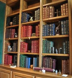 Library wall in the den is filled with leather bound, gilt edge volumes from Easton Press