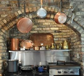 French copper for William Sonoma and other copper and brass - on the stove top is cast iron, Le Crueset, and other fine cooking pieces.