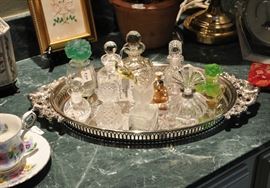Perfume bottle collection on a pretty silver plate tray