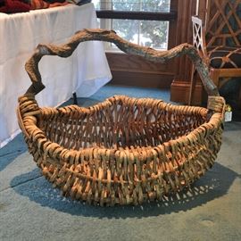 An extremely large hand made basket will hold a lot of books or several small children. (SOLD AT PREVIEW)