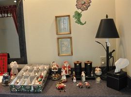 The nice metal lamp in this bathroom matches one in the master bath .  A collection of Santas join a retro Georges Briard dancing Christmas tree tray.