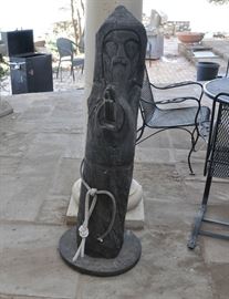 This is a 50" Ben Ortega St. Francis that has stayed in the garden.  The owner painted him with oil to protect him.  He has some weather related problems.