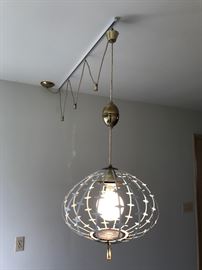 The duplex was built in 1965 and we are guessing this is the original mid century retro hanging light