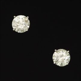 A Pair of Diamond Stud Earrings 