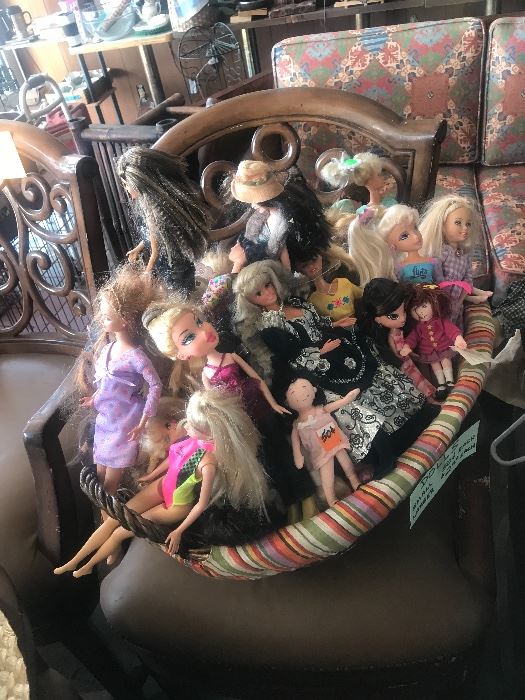 Basket of Barbie dolls and other dolls