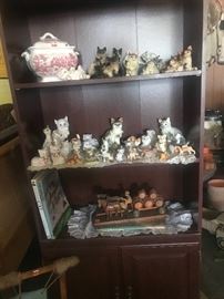Cat figurine collection in nice bookcase
