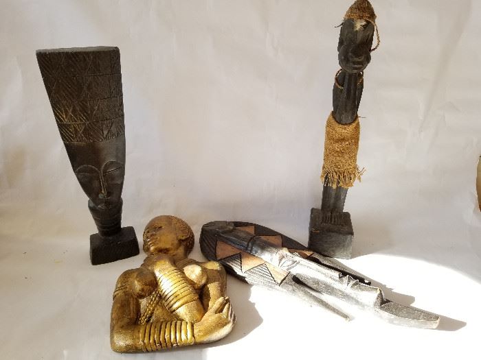 . Set of 4 Carved African Figures  http://www.ctonlineauctions.com/detail.asp?id=662284