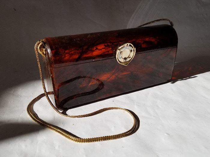  Amber Colored Marbled Plastic Purse  http://www.ctonlineauctions.com/detail.asp?id=662267