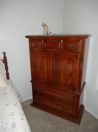 chest of drawers with cabinet opening