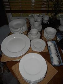 Farberware  service for 10, seven piece place setting , microwave and dishwasher safe.