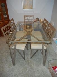 Glass top dining table with six chairs