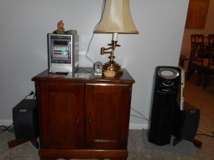 Boom Box, small side table, brass lamp, air purifier