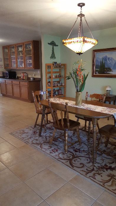 Dinette set table and 4 chairs, wool rug, shelves, Native American decorative pieces, Framed art