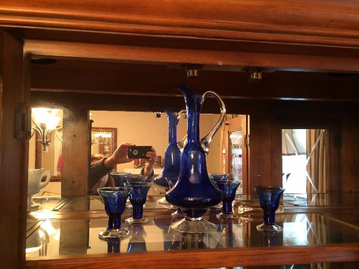Funky blue glass decanter and 5 glasses.