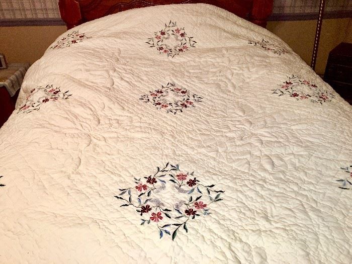 King quilt with delicate embroidered flowers