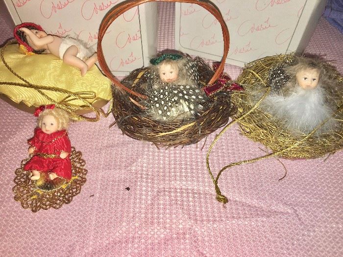 Detail of four of the 12 Marie Osmond articulated-porcelain-doll tree ornaments