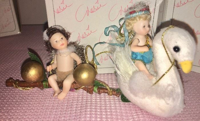 Detail of two of the 12 Marie Osmond articulated-porcelain-doll tree ornaments