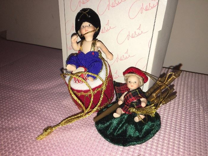 Detail of two of the 12 Marie Osmond articulated-porcelain-doll tree ornaments