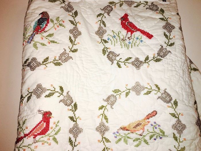 Cross-stitch quilted throw featuring birds of color