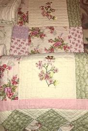 Gorgeous king quilt featuring patchwork, floral print, and ribbon-embroidered flowers