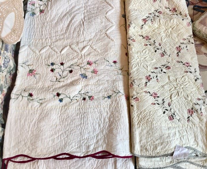 King quilts with dainty embroidered flowers