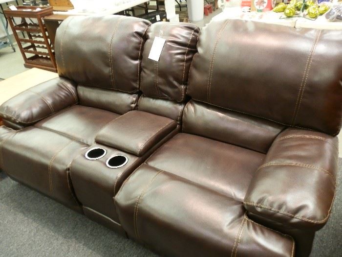 Same with the loveseat! Bad lighting! Dark brown, reclining with center console