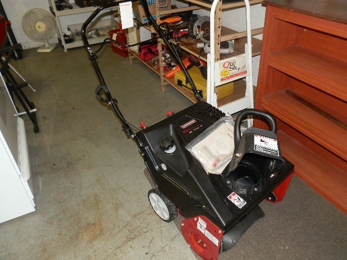 The snowblower is a Craftsman 5HP, 4 stroke! (No mixing oil!) It is less than 10 months old and was used twice for less than an hour total! 