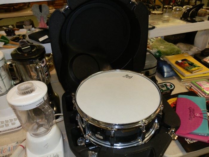 Pearl snare drum with case, sticks, & practice pad.