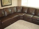 near new leather sectional  by Natuzzi with tags still attached