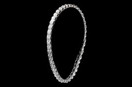 10K White Gold and 1.00 CTW Diamond Tennis Bracelet: A 10K white gold and 1.00 ctw diamond tennis bracelet. The bracelet features forty four round brilliant diamonds bezel set in square shaped 14K white gold links.