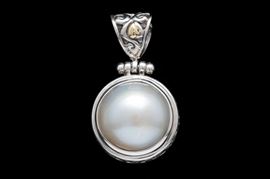 Sterling Silver, 18K Yellow Gold and Mabé Pearl Pendant: A sterling silver, 18K yellow gold and mabé pearl pendant.