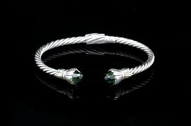 Robert Manse Sterling Silver, 18K Yellow Gold and Green Quartz Bracelet: A Robert Manse sterling silver, 18K yellow gold and green quartz bracelet featuring twisted arms, faceted green quartz end caps and 18K yellow gold accents.