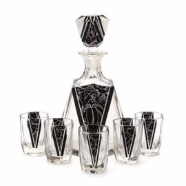 Czech Etched Black Enameled Glass Decanter and Tumbler Set: A Czech attributed glass decanter and five tumbler set featuring panels of black enameling etched with cloud-like designs and sun rays. The front of the decanter depicts a standing woman carrying a parasol among flower-like motifs and sun rays. The design is similar to Karl Palda’s Art Deco enameled glassware.