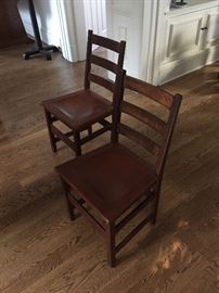 Stickley side chairs with leather seats.