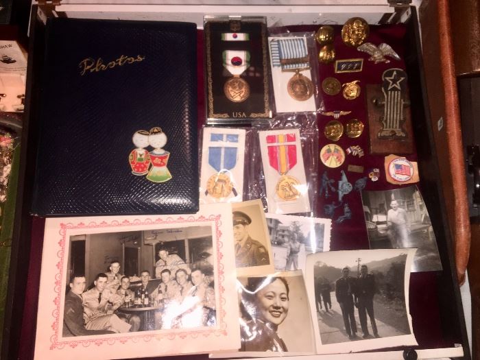 Showcase of WWll articles to include Photo's,  Photo Album,  Medals (Korea) Brass Medals and Buttons...