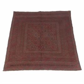 Hand-Knotted Baluch Area Rug: A hand-knotted Baluch area rug. This carpet has a palette of deep indigo, burgundy, and tan.It features a diamond lattice motif with dogdan guls and hooked brackets. It features compound borders of diamond shapes, running water patterns, and diagonal hooked motifs. It has short fringe to either end and overcast selvedges. Unlabeled.