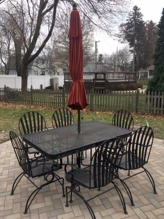 Patio table, umbrella and six chairs