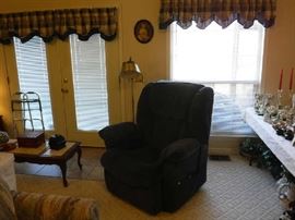 This is a light blue automatic reclining and lift chair. The window light kept messing up the shot.