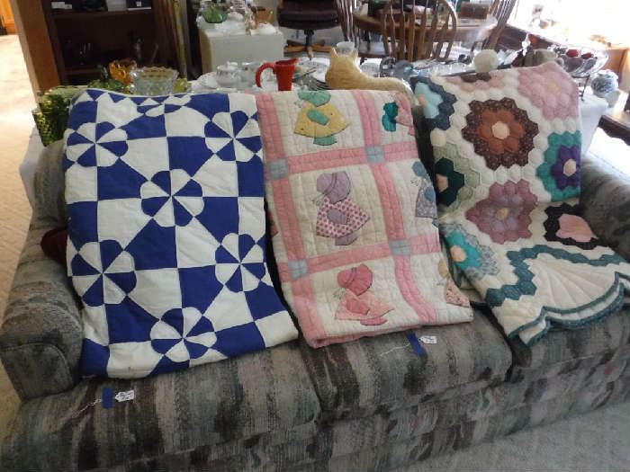 3 of the 4 quilts I have. I believe 2 at least look hand-stitched. Not are priced over $95.