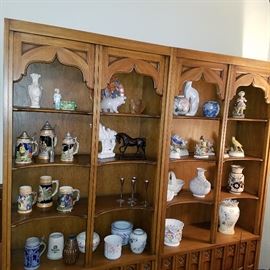 Open display shelves with steins, vases, figurines, etc.
