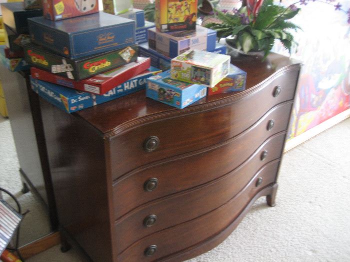 Retro wooden chest of drawers and puzzles and games