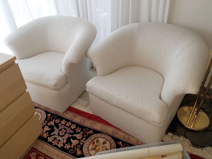 Pair of Selig swivel chairs