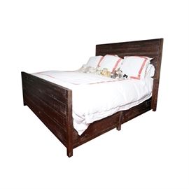 Rustic King Sized Bed: A rustic king sized bed. This bed features a plank headboard with whitewash that rises above square legs and connects to the side rails that feature drawers with knob pulls. The footboard features a plank design that rises above square legs. This item coordinates with items: 17BOS185-217 and 17BOS185-224. The mattress and bedding are not included.