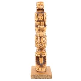 Ralph E. Hill Hand Carved Totem: A Ralph E. Hill hand carved totem. The totem depicts an eagle, seal, and whale, and has abalone eyes. Ralph E Hill is a Tsimshian carver from Prince Rupert, B.C and the totem is signed to the underside.