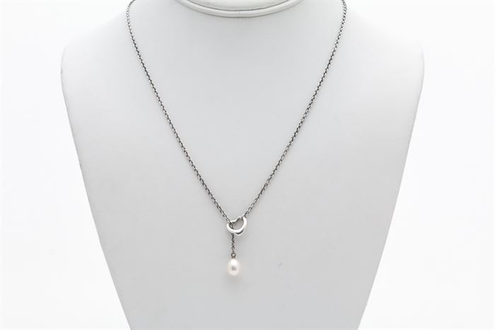 Tiffany & Co. Elsa Peretti Sterling Silver Freshwater Pearl Pendant Necklace: A Tiffany & Co. Elsa Peretti sterling silver cable chain with open heart connector and freshwater pearl drop to the end.