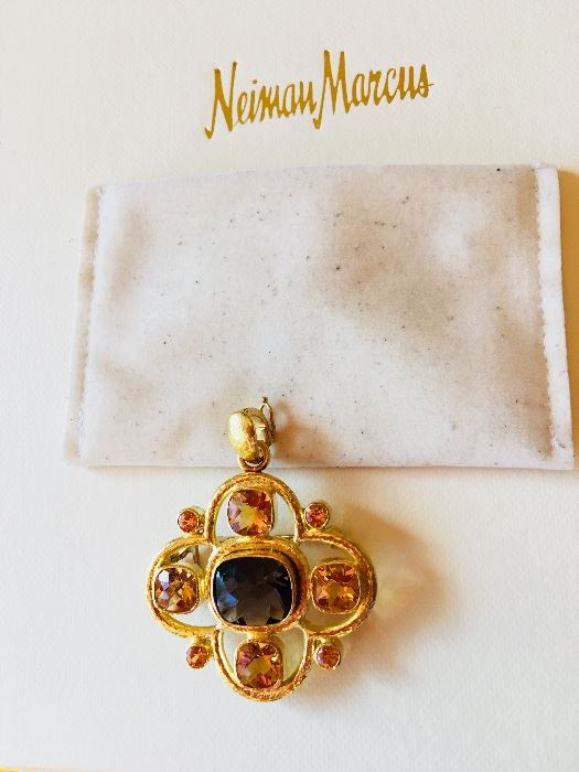 19K yellow gold and colored stone pendant featuring a center faceted cushion shaped smoky quartz surrounded by four squared shaped golden citrines and eight round cut mandarin garnets designed by Elizabeth Locke