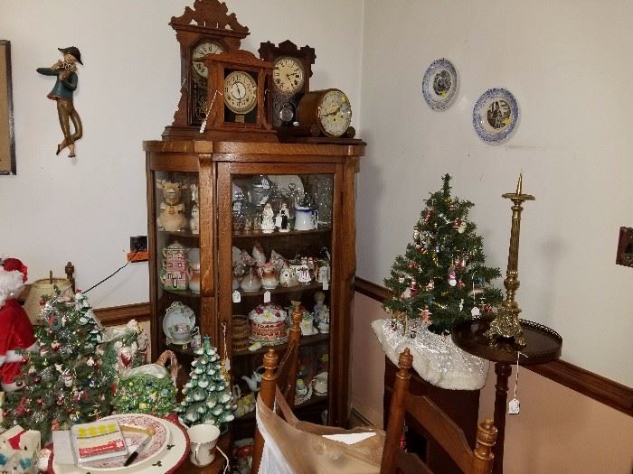 antique china cabinet with clock collection