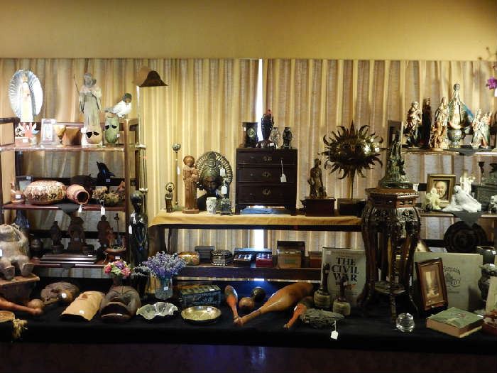 A LONG DISPLAY OF COLLECTIBLES